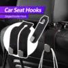 346a1145f04da693c909584ef86a6308.jpg_.webp Car Seat Headrest Hook Leather Metal Hook Storage Hanger Car Back Seat Foldable Hidden Hook Universal Car Interior Accessories